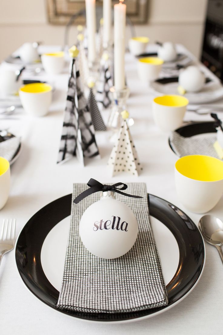 Christmas decorated table with white balls and paper made trees