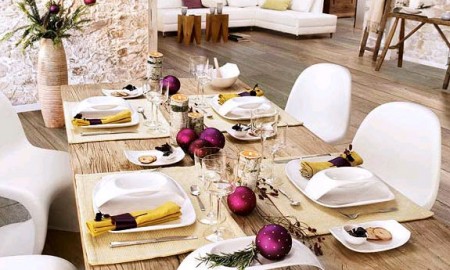 Christmas wooden table with purple balls and yellow napkins