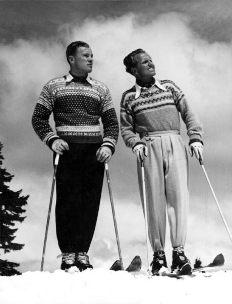 black and white old picture of men skiing