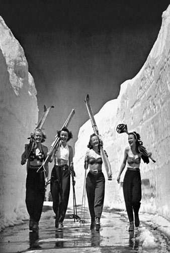 black and white vintage picture of women skiing