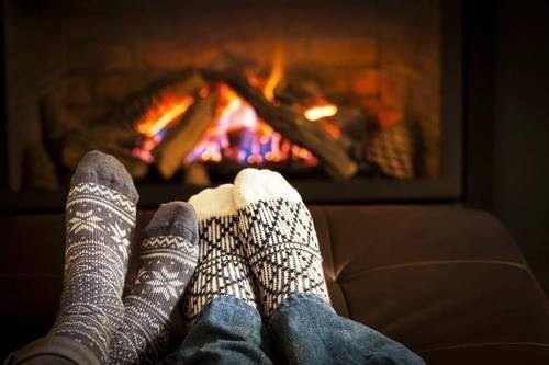 cosy socks in front of fireplace