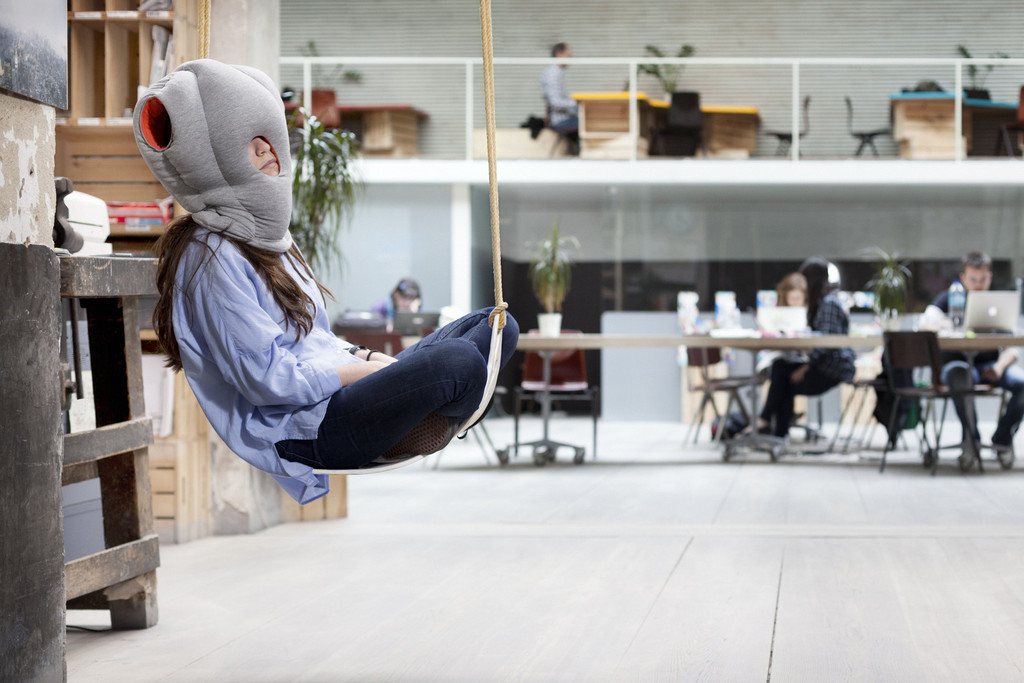 Ostrich pillow Girl sleeping in the mall