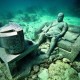 Underwater Museum in Cancun man watching tv sclupture