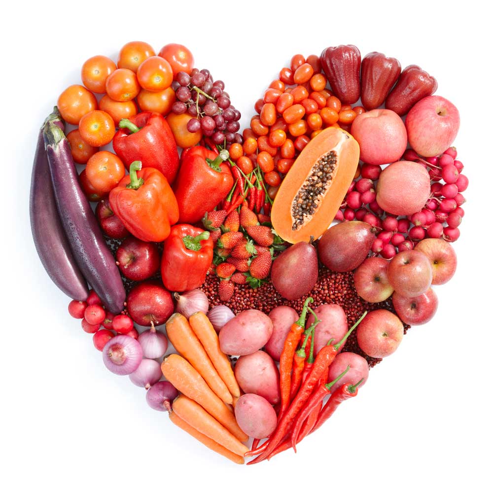 Heart-made-of-pink-and-red-vegetables-and-fruits