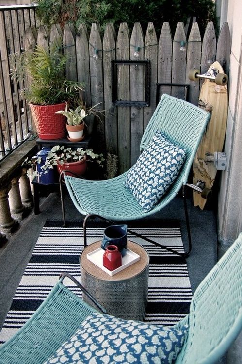 balcony with blue chairs