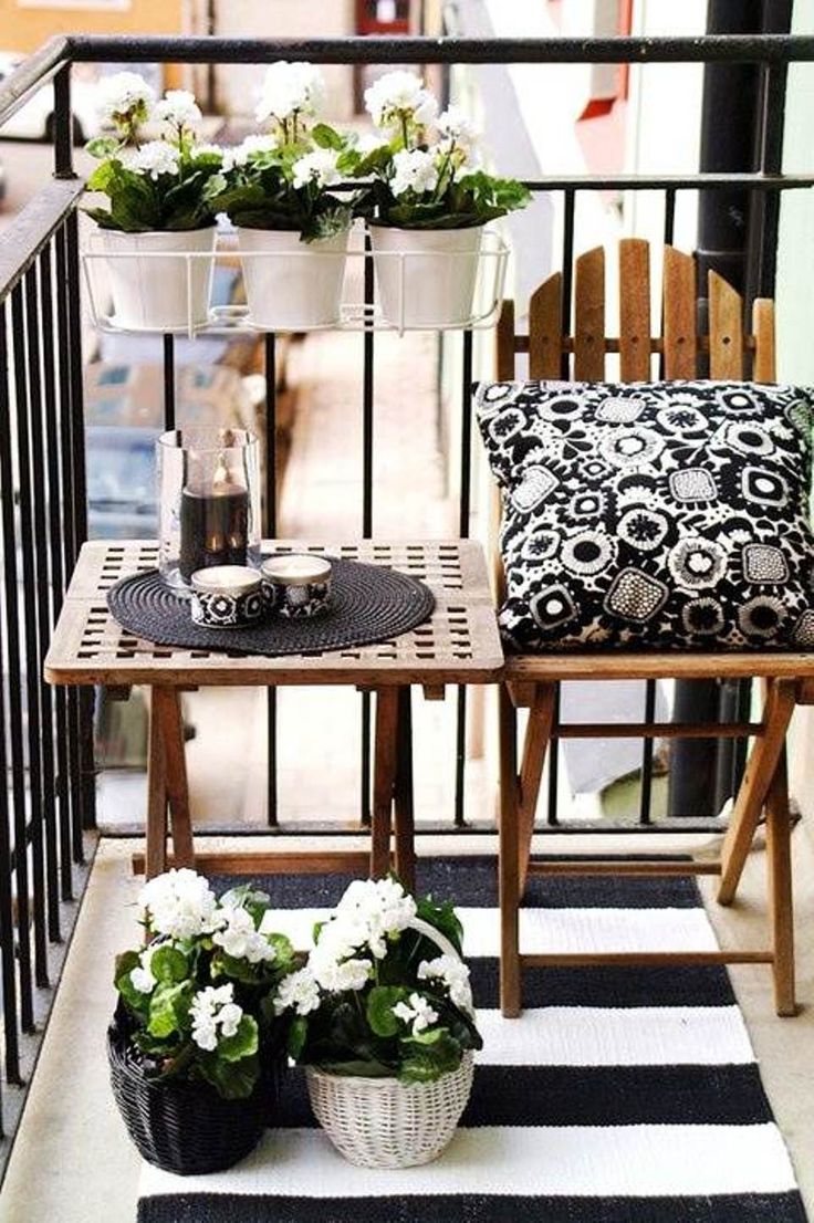 small balcony with black and white furnitures