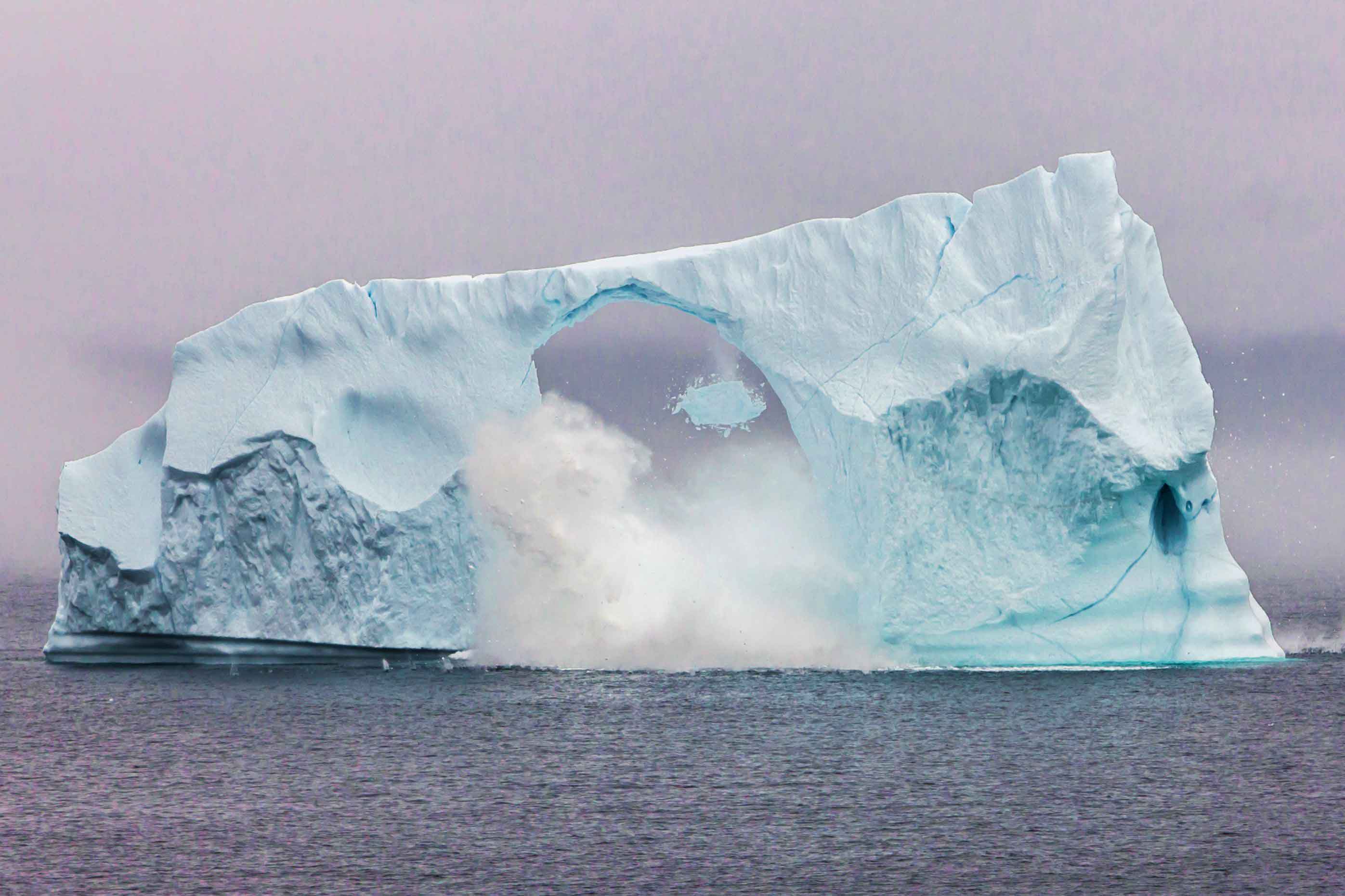 iceberg-breaking-into-two-chopping-ice-block
