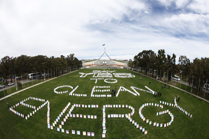 Overview of the lawn in front of Parliament show placards expressing support of a carbon tax in Canberra, Tuesday, Oct. 11, 2011. One thousand placards have been planted on the lawn at Parliament House to encourage politicians to vote 'yes' to a price on carbon pollution. (AAP Image/Lukas Coch)  NO ARCHIVING