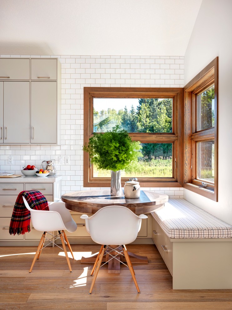 corner-window-kitchen-bench-of-eames-chairs-white-circular-table-wood-scandinavian-design