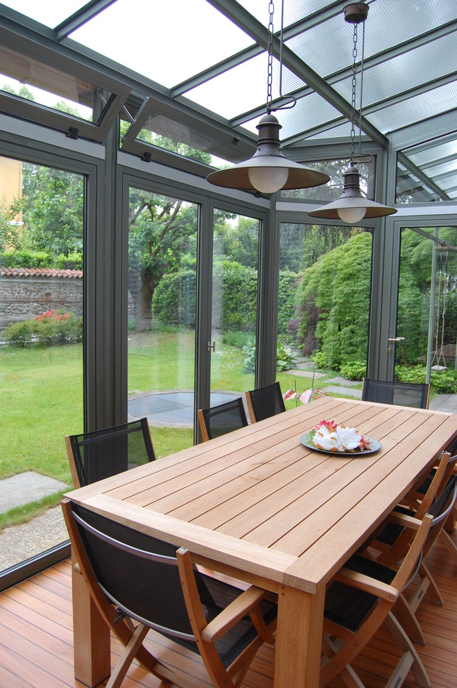 glass-veranda-with-wood-furniture-design-of-the-veranda