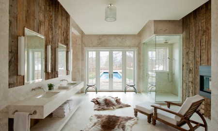 wood-wall-animal-fur-chaise-lounge-frankzosische-window-marble-shower-fireplace-opulent-and-rustic-bathroom-ideas