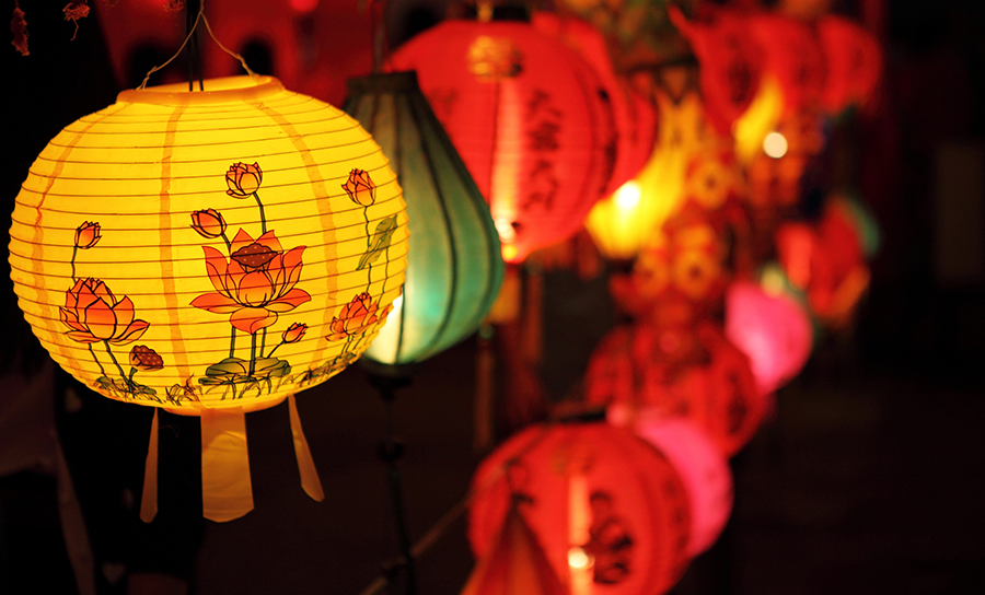 Illuminated lanterns decorated with paper lanterns