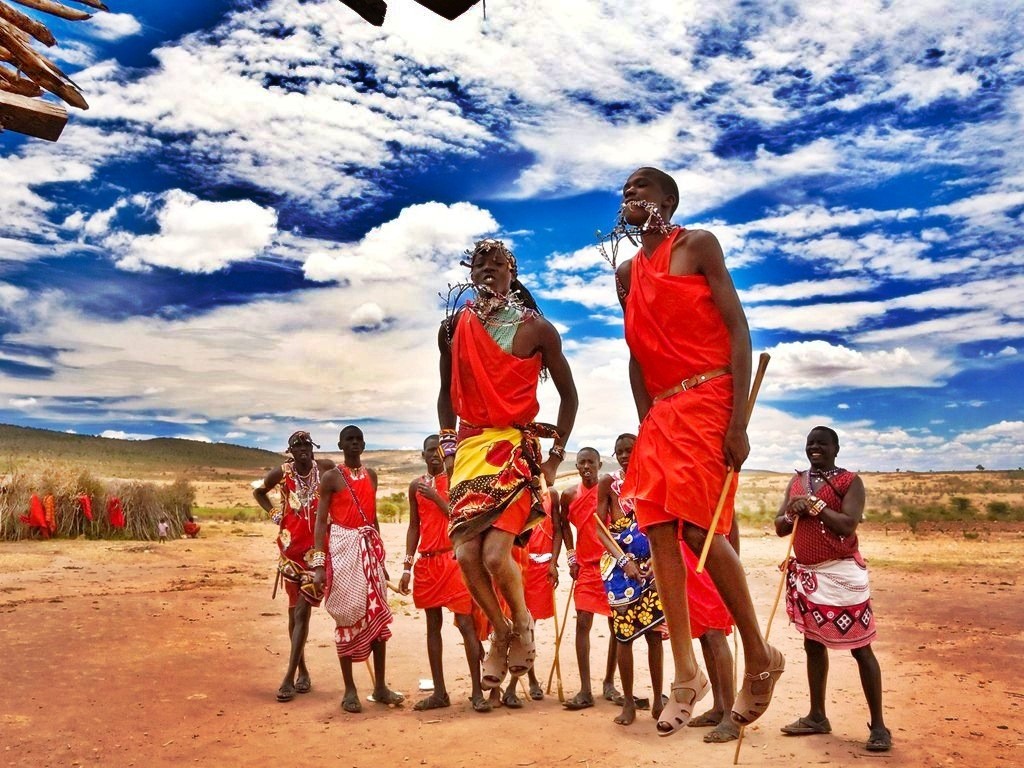 Masai family jumping Kenya landscape Colorful Clothes Masai Tribe