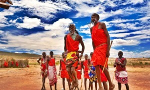 Masai family jumping Kenya landscape Colorful Clothes Masai Tribe