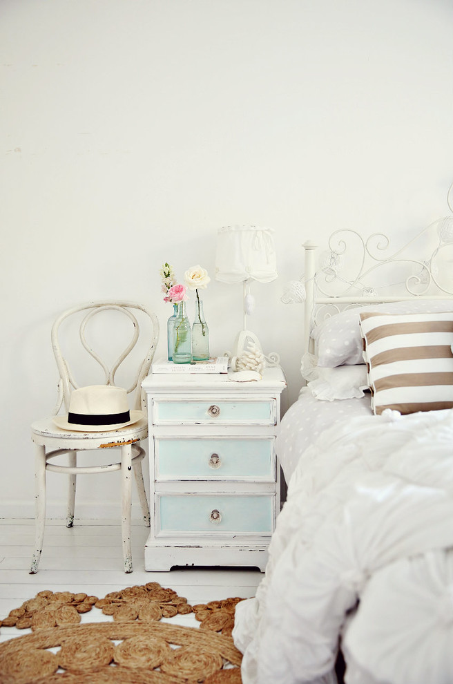 Bed headboard decorated metal chest of drawers chair wood flowers carpet white -Shabby chic furnishings