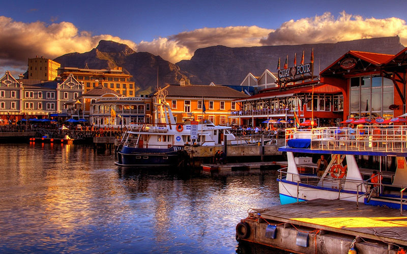 South-Africa,-Cape-Town-fall-harbor-boats-ocean-mountains-beautiful-buildings