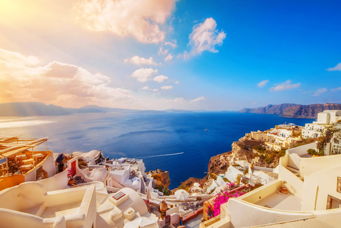 Santorini,-Greece-beautiful-sunshine-view-from-above-white-houses-flowers-sea