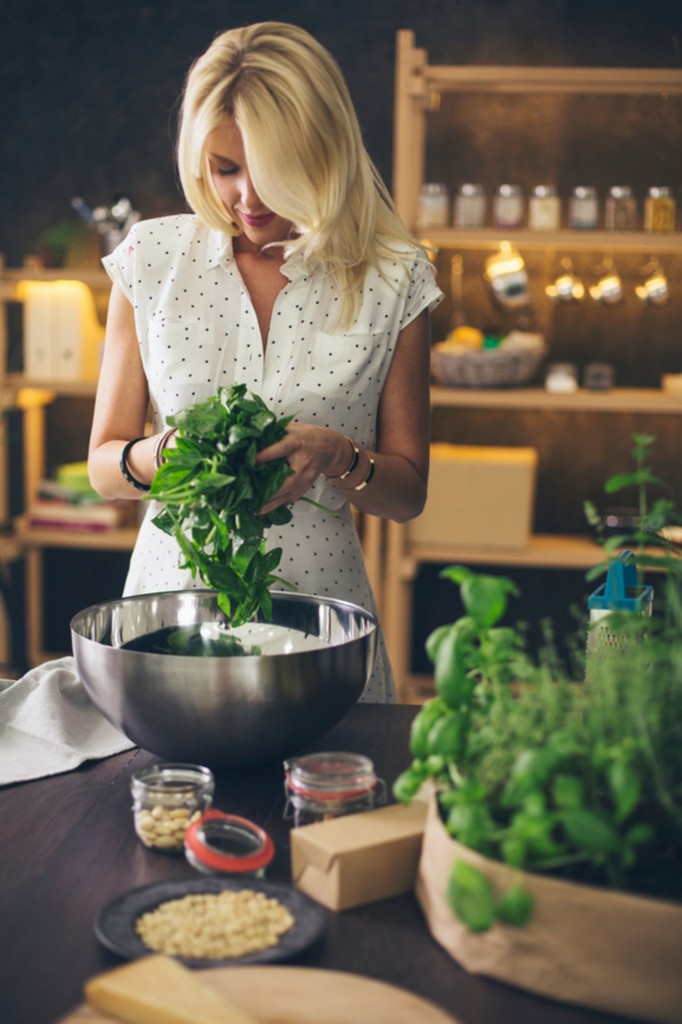 home herbs basil woman in kitchen growing herbs indoors herb garden window herb garden kitchen herb garden growing herbs herb planter indoor