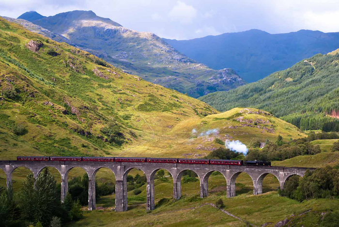 West-Highland-Line-Train-Beautiful-Landscape-Mountains-Green-train-travel-rail-travel-great-train-journeys-train-vacations-packages-best-train-trips-scenic-railroad-trips