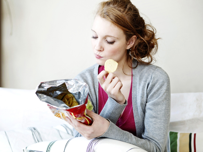 Woman-Eating-Snack-in-Livingroom-Snacks-healthy-snacks-snack-ideas-easy-snacks-snack-foods-evening-snacks