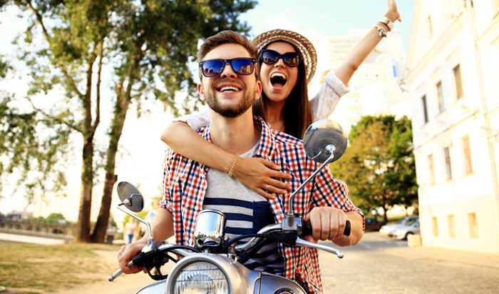 Happy-Couple-on-Bike-Enjoying-Life-romantic-weekend-getaways-romantic-vacations-romantic-trips-best-vacation-spots-for-couples-best-holiday-destinations-for-couples