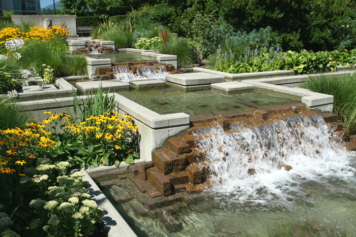 Big-Garden-Waterfall-Surrounded-by-Flowers-Beautiful-Backyard