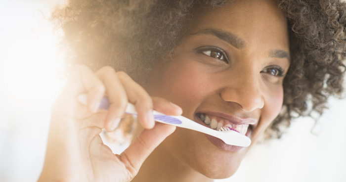 afro-american-girl-brushing-her-teeth