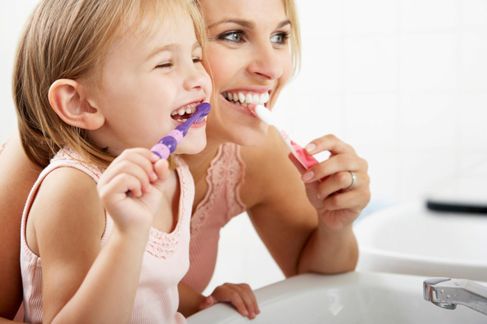 mother-and-child-brushing-teeth
