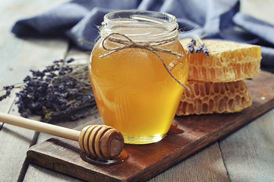 Natural honey in a jar with lavender 