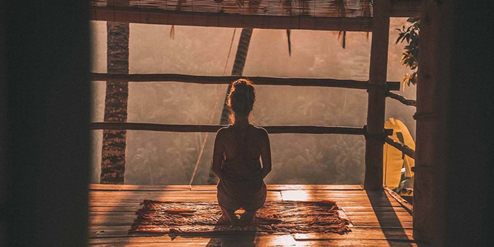 Girl Meditates in the nature 