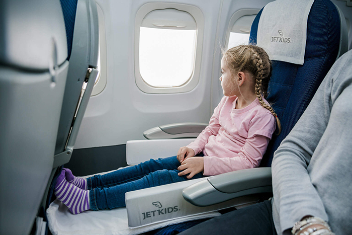 Girl flying on a plane 