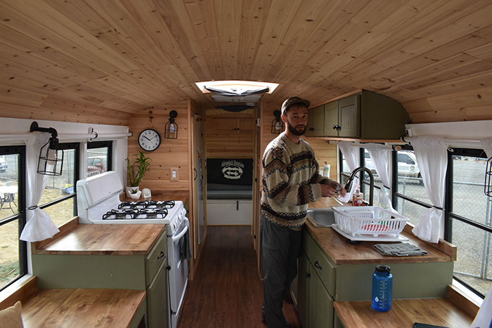 Man in a tiny bus house