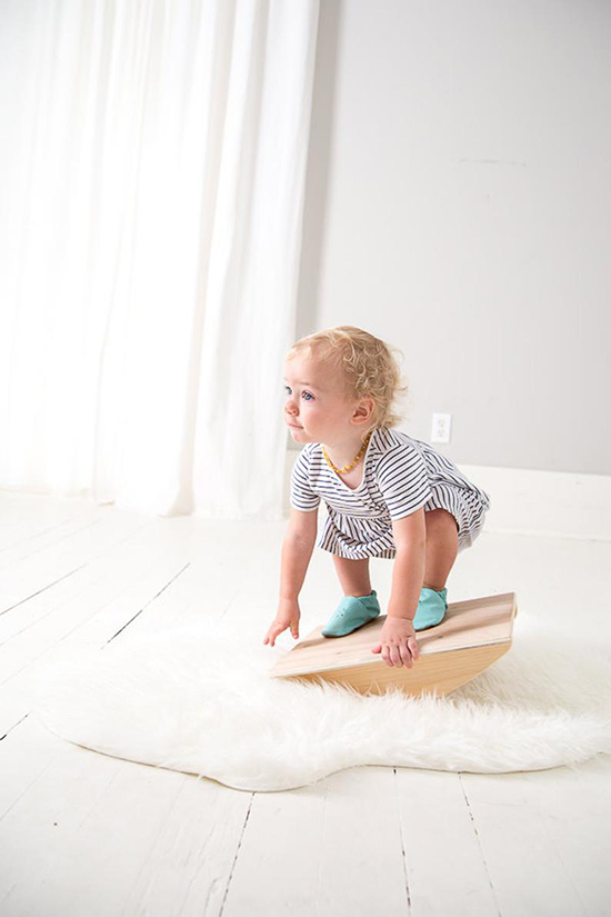 Kid playing with a wooden desk