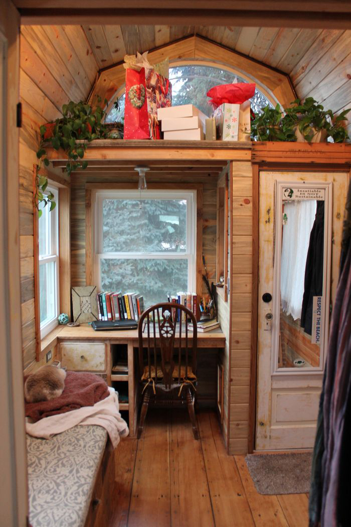 Wooden interior in tiny little house with big window