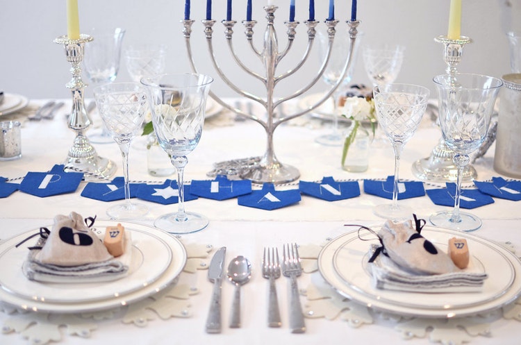 Elegant table decoration with Hanukkah menorah 