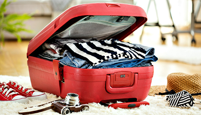 Overpacked red luggage