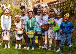 Happy kids collecting Easter eggs