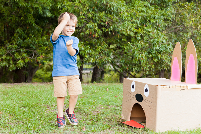 Kid playing Easter game outdoors