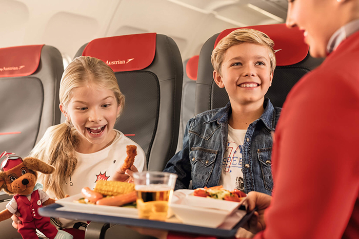 Kids having lunch served on a plane