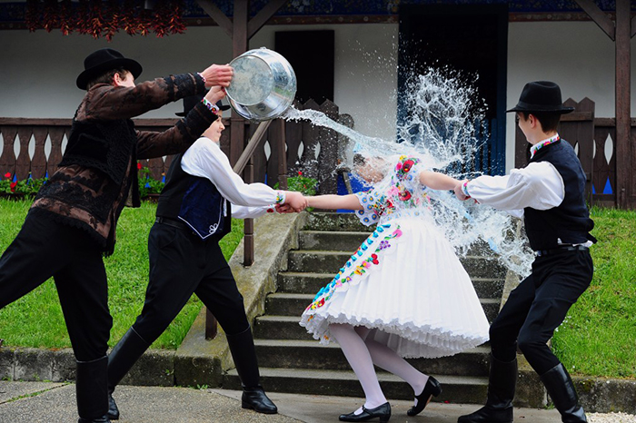 Hungary Easter tradition boys showers girl with water