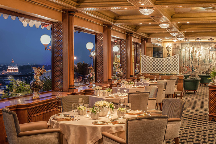 View and tables inside La Pergola restaurant in Rome