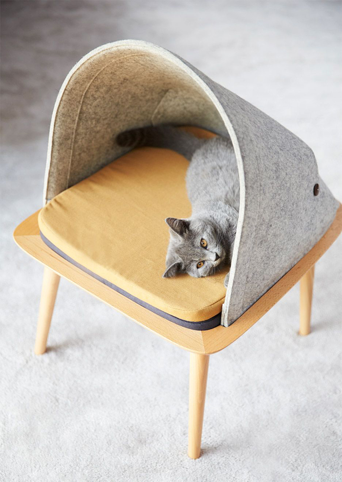 Cat in a simple pet house Scandinavian Design