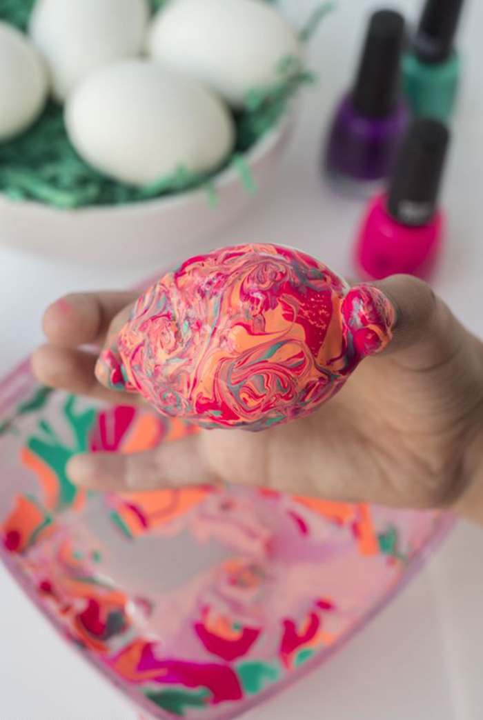 Pink and orange nail polish Easter egg design