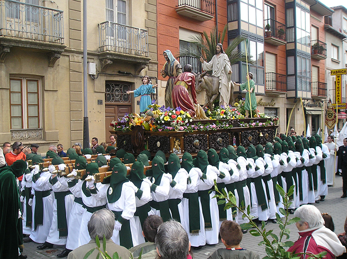 Men carrying Jesus Christ statue on the streets in Spain for Easter