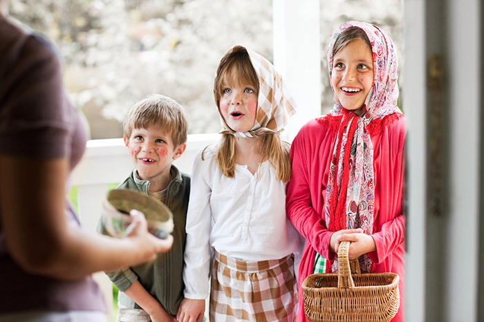 Kids gathering sweets for Swedish Easter tradition