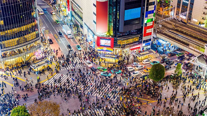Tokyo square full of people one of the fastest growing cities