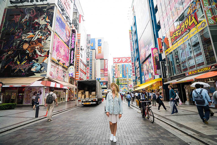 A girl standing on a street in Tokyo 