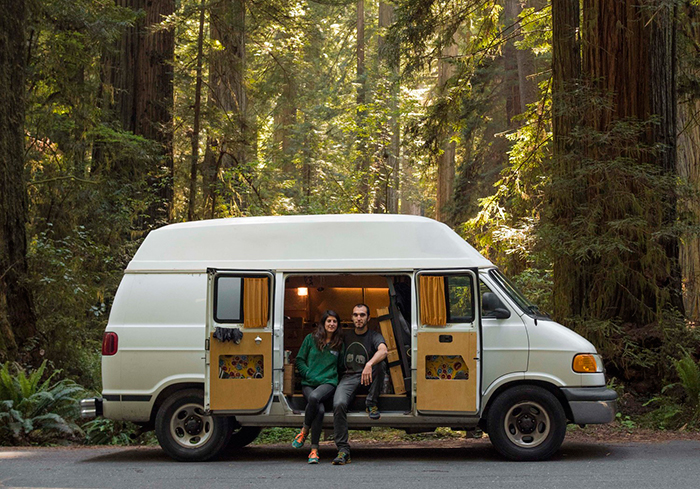 Couple sitting on a van house