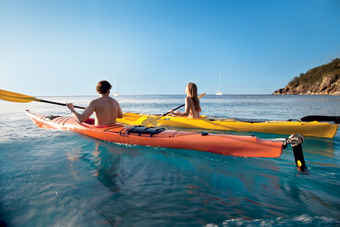 Man and Woman having fun while kayaking in Whitsunday Islands, Australia