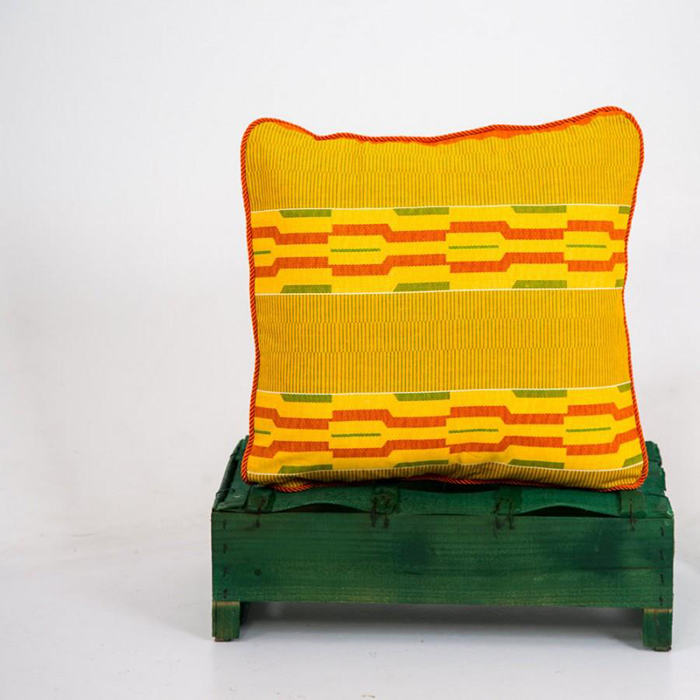 Yellow textile pillow with ethnic motives 